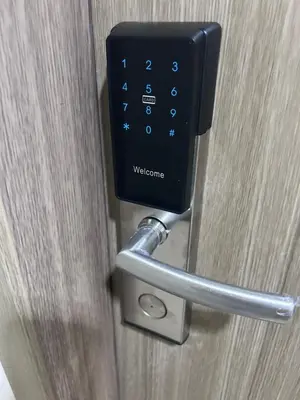 a door with a metal handle on a wooden door at Cozy Belle Suite Relaxing Place at SMDC Hope Residences in Trece Martires