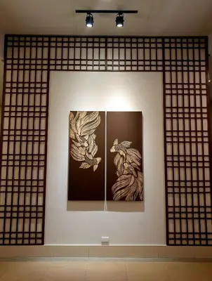 a room with two paintings on a wall at mandaluyong 2 br condo for rent in Manila