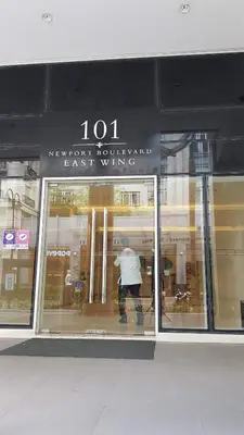 a man standing in the window of a store at 101 Newport blvd C2 4F by Rechelle Nunag in Manila