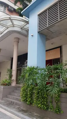 a blue building with plants in front of it at 101 Newport blvd C2 4F by Rechelle Nunag in Manila