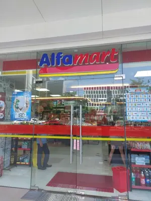 a store front of an atma mart with people in the window at Overnight @ Shakhbot's in Manila