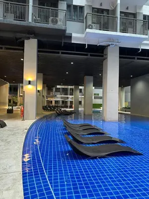 a row of swimming pools in a large building at S Residences Tower 3 MOA Luxe Staycation by C in Manila