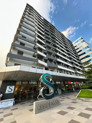 a large building with a sign in front of it at S Residences Tower 3 MOA Luxe Staycation by C in Manila
