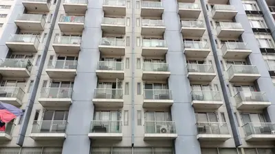 an apartment building with balconies in front of it at Hilanders Condotel in front of Terminal 3 in Manila