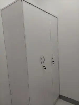 a bathroom with white cabinets and a shower at MOA staycation by Elsie D in Manila