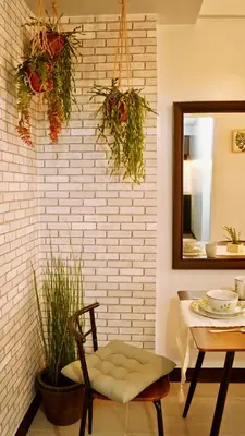 a room with a table and a chair and a mirror at Manila Airport Staycation near NAIA Terminal 3 in Manila