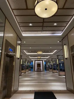 a hallway in a building with a ceiling with a light at Condo for Families and Friends in Manila