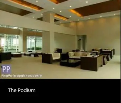a large room with couches and tables in a building at My Quiet Place at The Beacon - Makati City in Manila