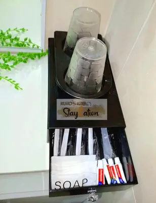 a book shelf with a sign that says stay alert at Condo in Pasay S Residences in Manila