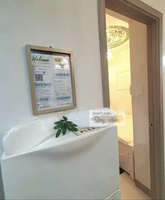 a sign on top of a refrigerator in a room at Condo in Pasay S Residences in Manila