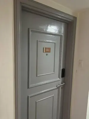 a door with a sign on it in a room at Exquisite Stays Private 2BR Rental in Manila