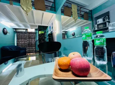 a tray of fruit on a counter with water bottles at Casa Jessica 329 Dubai style One bedroom Corner unit in Bacoor
