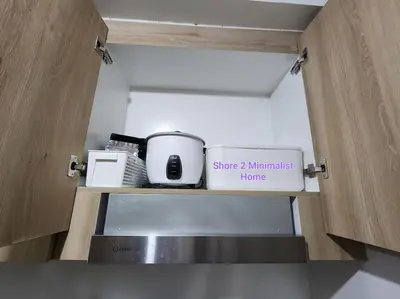 a kitchen with a shelf with appliances on it at SMDC Shore 2 Minimalist Home in Manila