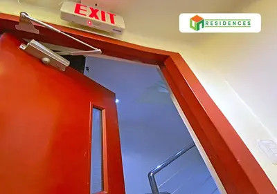 an exit sign and a door in a building at UN Residences in Manila