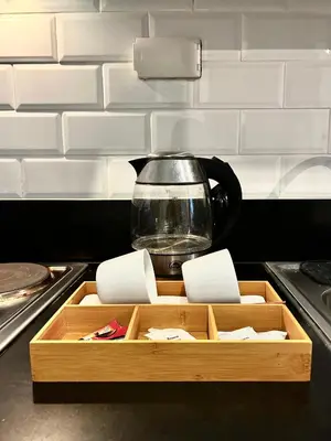 a tea kettle sitting on top of a kitchen counter at Evan Suite S Residences T1 in Manila