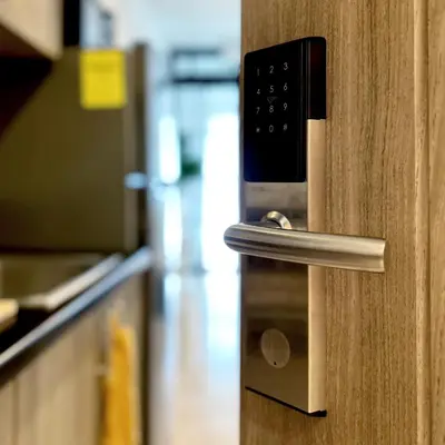 a close up of a door handle in a kitchen at Evan Suite S Residences T1 in Manila