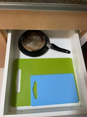 a stove top with a pan and a pot on it at Cozy 1 BR One Uptown Residences BGC in Manila