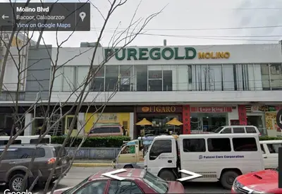 a group of vehicles parked in front of a store at Casa Jessica 326 Heavens Place One bedroom plus loft Condo Unit in Bacoor