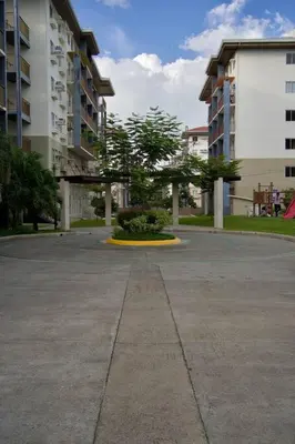 an empty parking lot in a city with buildings at Nuvali Laguna Amaia 2BR free parking @ The Sanctuary near Tagaytay and Carmelray Industrial Park in Numero Dos