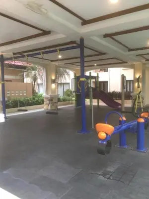 a park with a playground with a slide and a swingsearch at 1BR Condo at Montecito Newport City Residential Resort across NAIA and Marriott Hotel in Manila