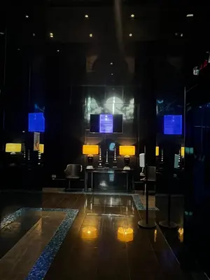 a room with a stage with chairs and blue screens at The Milano Residences in Manila