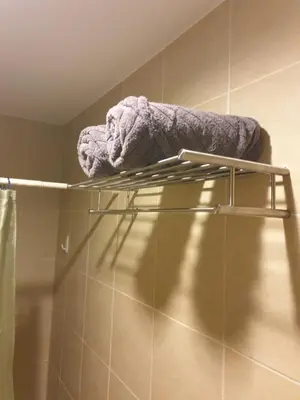 a towel on a towel rack in a bathroom at Mosaic 10H - Greenbelt Studio in Manila