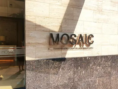 a museum sign on the side of a building at Mosaic 10H - Greenbelt Studio in Manila