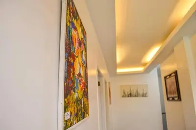 a stained glass window on a wall in a hallway at Budget Accomodation in San Pablo City Laguna in Manila