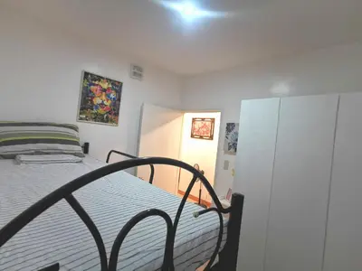 a small bedroom with a bed and a cabinet at Budget Accomodation in San Pablo City Laguna in Manila