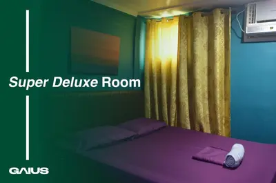 a bedroom with a bed with purple sheets and a window at Gaius Inn in Manila