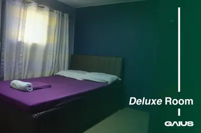 a bedroom with a purple bed with a purple room i cavus at Gaius Inn in Manila