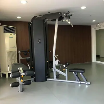 a gym with two chairs and a mirror at Staycation by JAR - Condo Unit in Manila