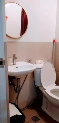 a bathroom with a sink and a toilet and a mirror at Hantowah's Crib - Southwoods in San Pedro