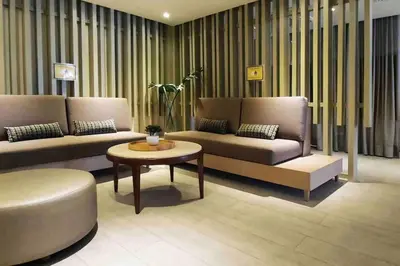 a living room with two couches and a coffee table at Luxe 1BR w/ Balcony @ Uptown Parksuites in Manila