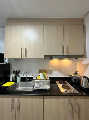 a kitchen with a sink and a counter top at Night Blink Staycation and Rentals in Manila