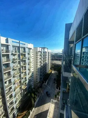 an aerial view of a city with tall buildings at Palm Tree Villas in Manila