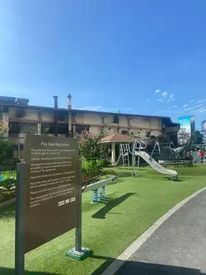a park with a slide and a playground at Prisma Residences - Celeste Bldg in Manila