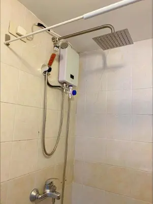 a shower in a bathroom with a shower at One Bedroom condo Unit in Eastwood Libis . Fast free wifi /netflix in Manila