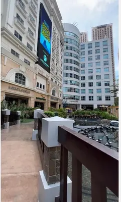 a view of a building with a sign on it at One Bedroom condo Unit in Eastwood Libis . Fast free wifi /netflix in Manila