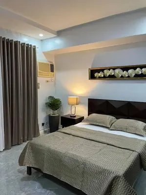 a bedroom with a large bed in a room at My Suite Heart of San Juan City near Greenhills, Ortigas with Roof Garden in Manila