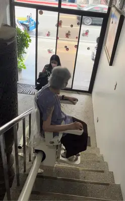 a woman sitting on a toilet on the stairs at My Suite Heart of San Juan City near Greenhills, Ortigas with Roof Garden in Manila