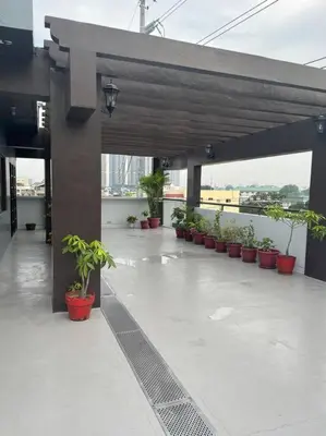 a patio with potted plants on a building at My Suite Heart of San Juan City near Greenhills, Ortigas with Roof Garden in Manila