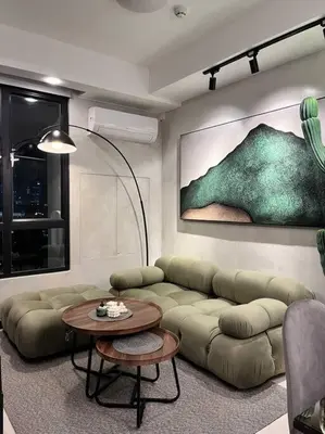 a living room with a couch and a table at The DRYM Space — Curated Staycation in Mandaluyong in Manila