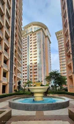 a fountain in front of two large buildings at 12e Spacious Cozy Suite at The Venice Mall with FREE Parking and Washing Machine in Manila