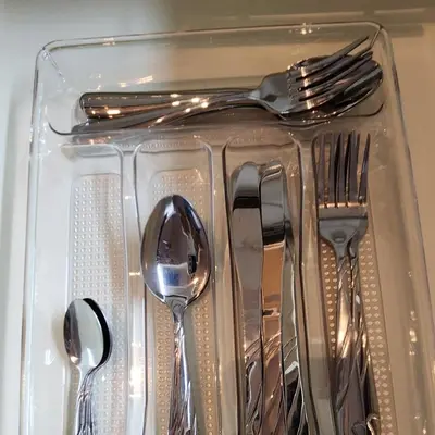 a plastic container with silver utensils in it at 12e Spacious Cozy Suite at The Venice Mall with FREE Parking and Washing Machine in Manila