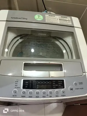 a toaster oven is sitting on a table at Condotels Near Terminal 3 Airport in Manila