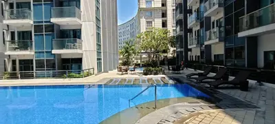 a swimming pool in the middle of a building at Condotels Near Terminal 3 Airport in Manila