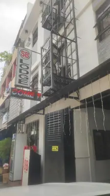a building with a sign on the side of it at SB LODGE TAGUIG in Manila