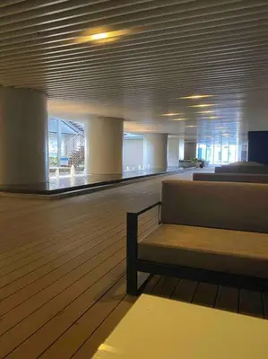 a room with a bench in the middle of a building at Royal Victorian Studio in Makati in Manila