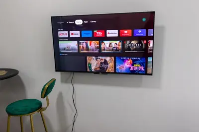 a flat screen tv hanging on a wall at Royal Victorian Studio in Makati in Manila